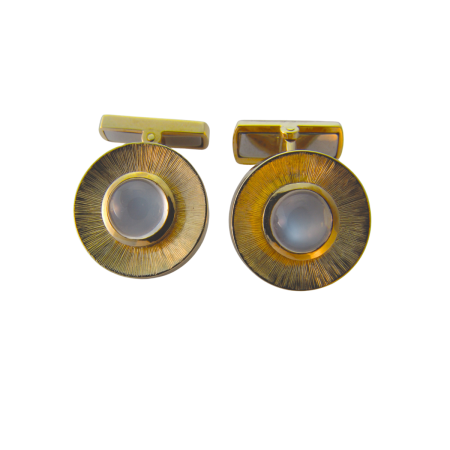 1079 Rock Crystal & Tsavorite Flowing Lines Cufflinks Designed & Handmade by Kaufmann de Suisse in 18kt Yellow Gold featuring 2 Carved Rock Crystals measuring 12 x 12 and 2 Round Bezel Set Tsavori