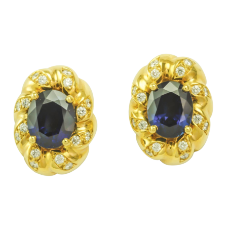 16170 Flowing Lines Sapphire & Diamond Clip On Earrings Designed & Handmade by Kaufmann de Suisse in 18kt Yellow Gold featuring 2 Oval Blue No Heat Sapphires weighing a total of 6.00cts mounted wi