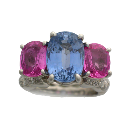 16760 Double Flowing Lines 3 Stone Blue and Pink Sapphire Ring Designed & Handmade by Kaufmann de Suisse in Platinum featuring one Oval 5.37cts Purplish Blue Sapphire flanked by 2 No Heat Pink Sap